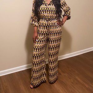 "New" One Piece Gold Jumper with original tags.